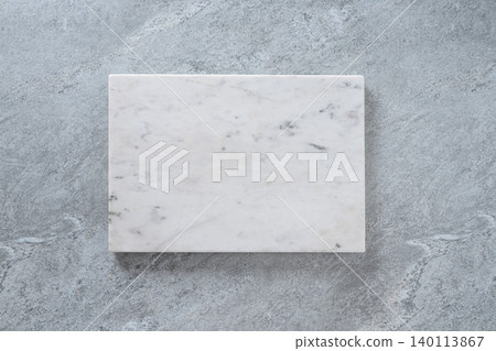 White marble board on gray stone background 140113867