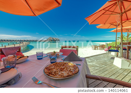 Stunning Maldives resort oceanfront dining orange umbrellas gourmet food table breathtaking luxury alfresco tropical lagoon serene idyllic coastal escape leisure lifestyle hospitality vacation vibrant Stunning Maldives resort oceanfront dining orange umbrellas gourmet food table breathtaking luxury alfresco tropical lagoon serene idyllic coastal escape leisure lifestyle hospitality vacation vibrant 140114061