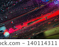 Droplets on glass form liquid texture with red streak, bubbles, dark reflective layers. Natural art background for modern creative design 140114311