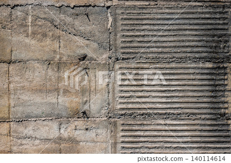 Textured Concrete Wall with Ribbed Grooves and Rusty Nails Textured Concrete Wall with Ribbed Grooves and Rusty Nails 140114614