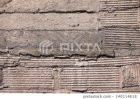 Textured Concrete Wall Surface with Horizontal Grooves 140114618