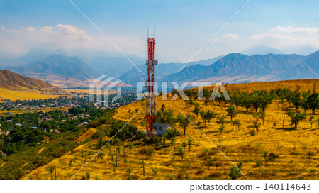 Telecommunications Tower on Hillside Overlooking Valley in Kyrgyzstan Telecommunications Tower on Hillside Overlooking Valley in Kyrgyzstan 140114643