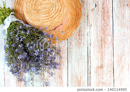 Bouquet with beautiful spring forget-me-nots and a hat on a sunny background, abstract floral arrangement, still life with spring flowers of different varieties, floral greeting card, screen banner, Bouquet with beautiful spring forget-me-nots and a hat on a sunny background, abstract floral arrangement, still life with spring flowers of different varieties, floral greeting card, screen banner, 140114995