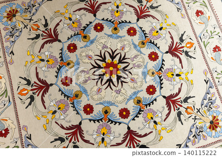 Intricate hand-embroidered suzani textile featuring a circular floral medallion, Intricate hand-embroidered suzani textile featuring a circular floral medallion, 140115222