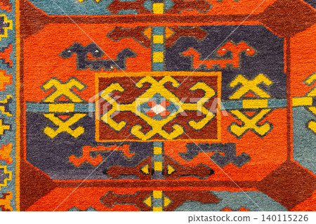 Close-up of a colorful Uzbek rug showing bold geometric motifs Close-up of a colorful Uzbek rug showing bold geometric motifs 140115226