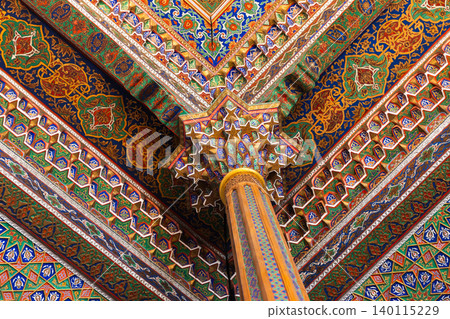 Intricately painted Islamic architectural column and ceiling 140115229