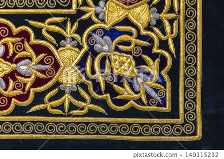 Luxurious velvet textile embroidered with intricate gold thread floral motifs Luxurious velvet textile embroidered with intricate gold thread floral motifs 140115232