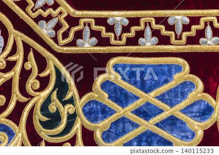 Close-up of luxurious gold-embroidered velvet textile Close-up of luxurious gold-embroidered velvet textile 140115233