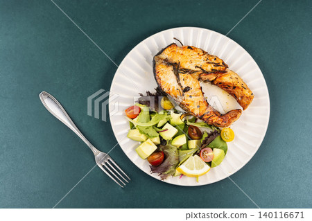 Grilled Trout Steak with Mixed Greens and Avocado Salad Grilled Trout Steak with Mixed Greens and Avocado Salad 140116671