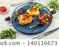 Gourmet grilled stuffed squid on skewers. 140116673