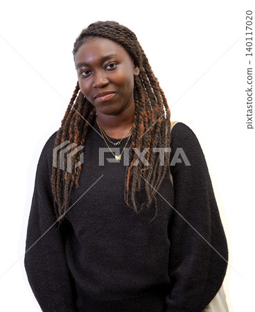 Half-length cutout portrait of a casual young Black woman with long braids isolated on a white background Half-length cutout portrait of a casual young Black woman with long braids isolated on a white background 140117020