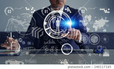 男性在辦公室工作並運用數位科技的概念。 男性在辦公室工作並運用數位科技的概念。 140117185