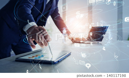 A man working in an office and the concept of a communication network. A man working in an office and the concept of a communication network. 140117198