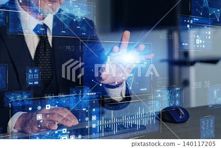 The concept of a man working in an office and digital technology. The concept of a man working in an office and digital technology. 140117205