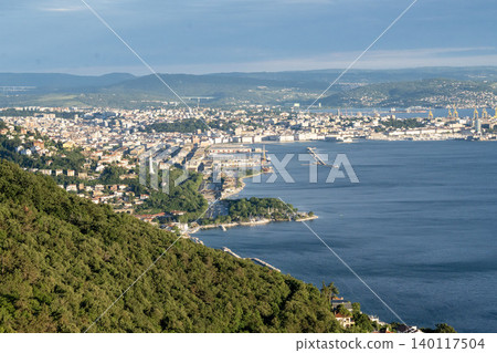 Aerial View Of Trieste City Harbour From Napoleonica Hiking Trail - Famous Climbing Bouldering Area, Gulf Of Trieste Adriatic Italy, Panoramic Karst Hillside Overlook Aerial View Of Trieste City Harbour From Napoleonica Hiking Trail - Famous Climbing Bouldering Area, Gulf Of Trieste Adriatic Italy, Panoramic Karst Hillside Overlook 140117504