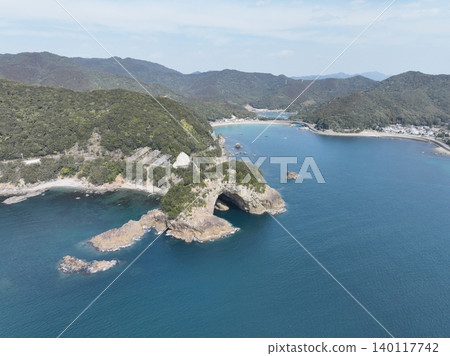 Aerial photograph of the unique rock formations of Ebisu Cave in Minami-cho, Tokushima Prefecture, and the Pacific Ocean. Aerial photograph of the unique rock formations of Ebisu Cave in Minami-cho, Tokushima Prefecture, and the Pacific Ocean. 140117742