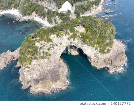 Aerial photograph of the unique rock formations of Ebisu Cave in Minami-cho, Tokushima Prefecture, and the Pacific Ocean. Aerial photograph of the unique rock formations of Ebisu Cave in Minami-cho, Tokushima Prefecture, and the Pacific Ocean. 140117772