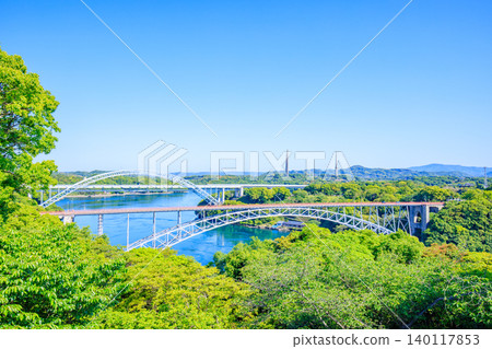 Early summer in Saikai Bridge Park: Saikai Bridge and Hariu Transmitting Station as seen from the observation deck, Saikai City, Nagasaki Prefecture. Early summer in Saikai Bridge Park: Saikai Bridge and Hariu Transmitting Station as seen from the observation deck, Saikai City, Nagasaki Prefecture. 140117853