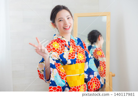 A woman in a yukata A woman in a yukata 140117981