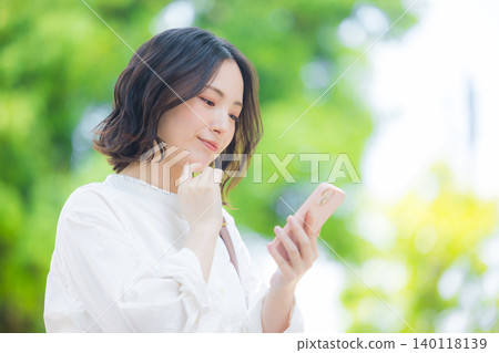 Woman with smartphone Woman with smartphone 140118139