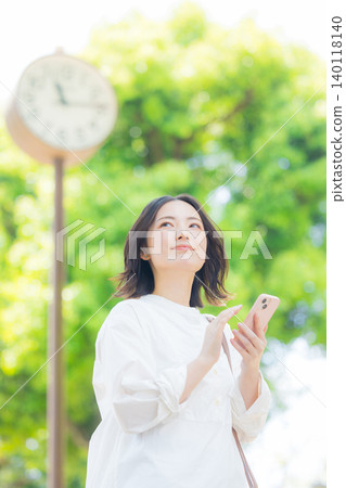 Woman with smartphone Woman with smartphone 140118140