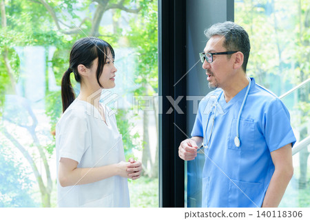 Doctor and nurse consulting at hospital Doctor and nurse consulting at hospital 140118306