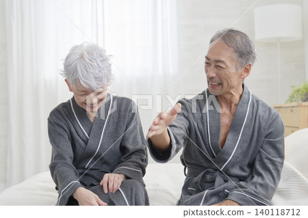 Senior couple having a conversation in the bedroom Senior couple having a conversation in the bedroom 140118712