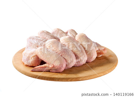 fresh raw chicken wings on a cutting board isolated on a white background, top view. 140119166