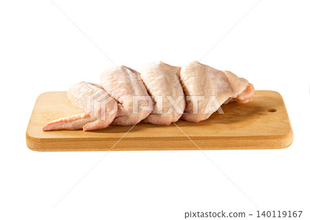 fresh raw chicken wings on a cutting board isolated on a white background, top view. fresh raw chicken wings on a cutting board isolated on a white background, top view. 140119167