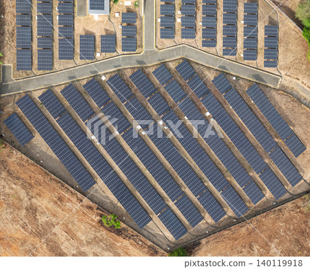 Solar panel farm located in an open area with multiple rows of panels Solar panel farm located in an open area with multiple rows of panels 140119918
