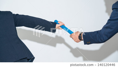 A group of business people passing the relay baton A group of business people passing the relay baton 140120446