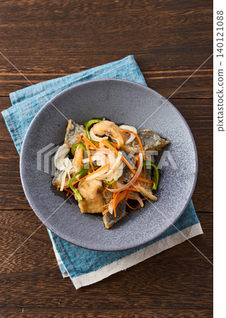 Marinated horse mackerel with onion, carrot, and bell pepper. Marinated horse mackerel with onion, carrot, and bell pepper. 140121088