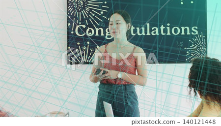 Presenting woman holding smartphone in red top at office, Congratulations banner and teal grid Presenting woman holding smartphone in red top at office, Congratulations banner and teal grid 140121448