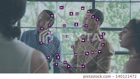 Collaborating team of four in business casual standing by multipane window, holding tablet overlay 140121472