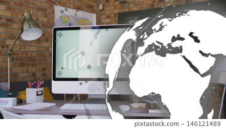 Showing white all-in-one desktop on wooden desk at home office, with globe graphic overlay 140121489