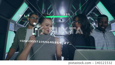 Walking four adults examining open laptop with AR overlays in high-tech corridor, progress 33% Walking four adults examining open laptop with AR overlays in high-tech corridor, progress 33% 140121532