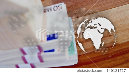 Displaying banded 50 EUR bills with straps on wooden table, showing white dotted map and globe Displaying banded 50 EUR bills with straps on wooden table, showing white dotted map and globe 140121717
