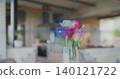Displaying clear glass vase holding roses in living room with blue HUD overlay and lens flare 140121722