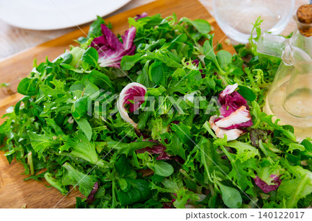 Healthy salad from Canonigos lettuce leaves, radicchio and endive close up Healthy salad from Canonigos lettuce leaves, radicchio and endive close up 140122017