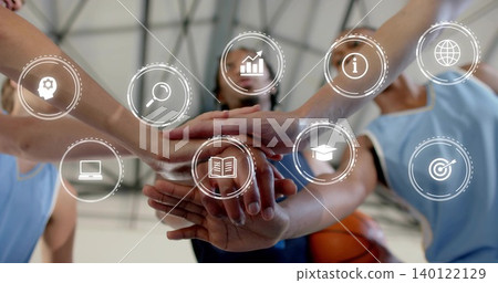 Stacking five in lightblue basketball jerseys placing hands in gym, with basketball, digital icons Stacking five in lightblue basketball jerseys placing hands in gym, with basketball, digital icons 140122129