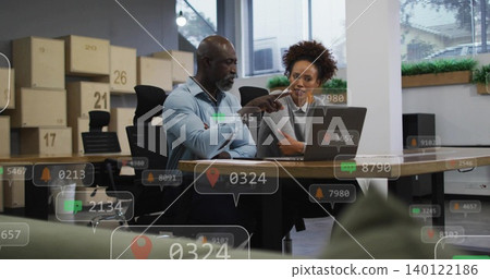 Pointing colleagues in business, working at office, viewing laptop with numbered boxes, AR overlays Pointing colleagues in business, working at office, viewing laptop with numbered boxes, AR overlays 140122186