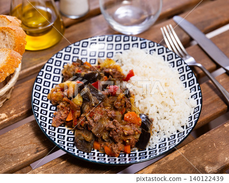 Stewed eggplants with minced meat and white rice closeup Stewed eggplants with minced meat and white rice closeup 140122439