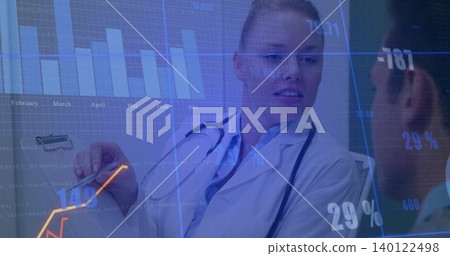 Explaining doctor in white coat pointing pen at clipboard in clinic, with AR charts, stethoscope Explaining doctor in white coat pointing pen at clipboard in clinic, with AR charts, stethoscope 140122498