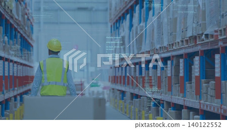 Walking warehouse worker pushing pallet between pallet racks, wearing yellow hard hat and neon vest Walking warehouse worker pushing pallet between pallet racks, wearing yellow hard hat and neon vest 140122552