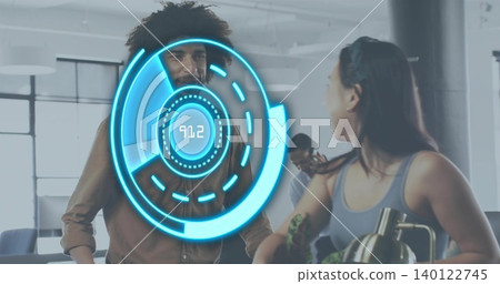 Talking coworkers wearing brown shirt and grey tank, leaning at office counter with blue holo 91 140122745