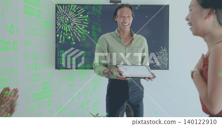 Presenting man in light green shirt with tablet at office, screen with green fireworks overlay Presenting man in light green shirt with tablet at office, screen with green fireworks overlay 140122910
