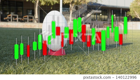 Showing white oval ball resting on red kicking tee on campus pitch, with candlestick overlay Showing white oval ball resting on red kicking tee on campus pitch, with candlestick overlay 140122996