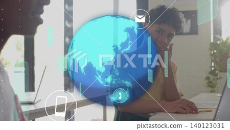 Working teen wearing T-shirt typing on laptop, resting chin at home office with holographic globe Working teen wearing T-shirt typing on laptop, resting chin at home office with holographic globe 140123031