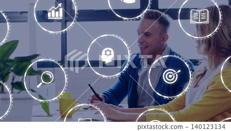 Reviewing colleagues in yellow cardigan blue sweater gesturing at laptop in office, analytics icons Reviewing colleagues in yellow cardigan blue sweater gesturing at laptop in office, analytics icons 140123134