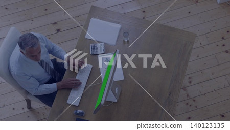 Typing man in business attire at home office desk, using white keyboard and mouse, copy space Typing man in business attire at home office desk, using white keyboard and mouse, copy space 140123135